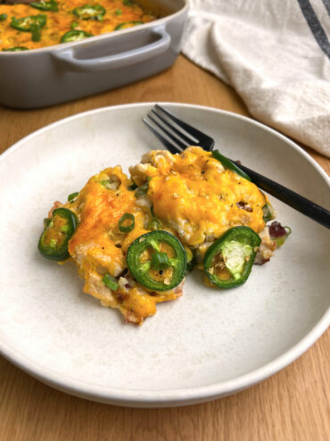 Jalapeno Popper Chicken Casserole on White Plate with Black Fork