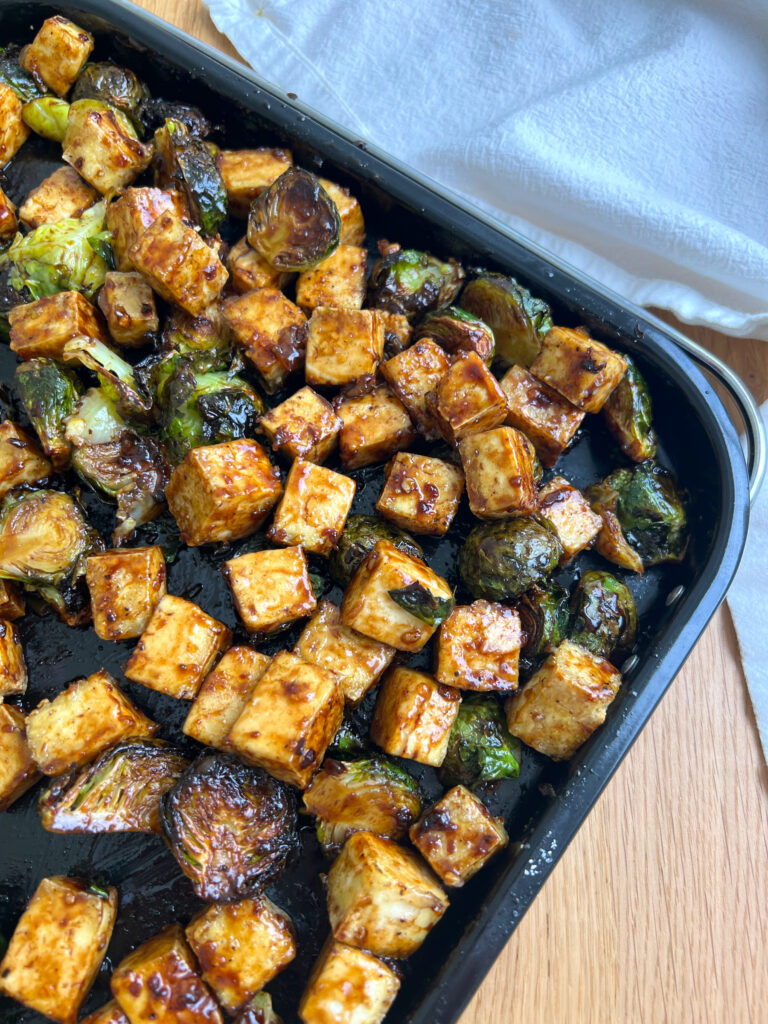 Brussels sprouts & tofu tossed with balsamic sauce on air fryer tray