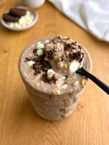 Cookies and Cream Overnight Oats in glass jar with black spoon