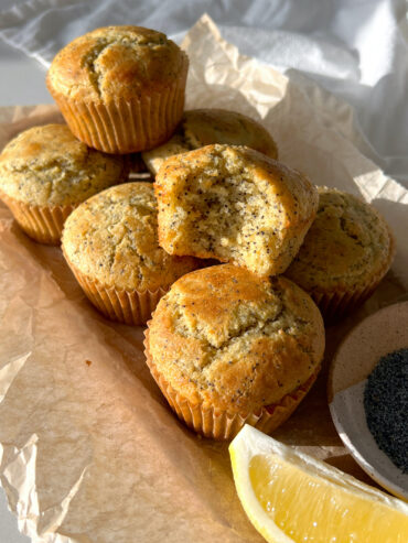 finished gluten free lemon poppyseed muffins with a bite taken out