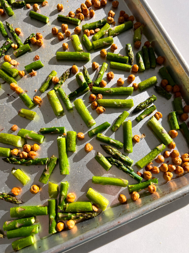 Asparagus and chickpeas on baking sheet