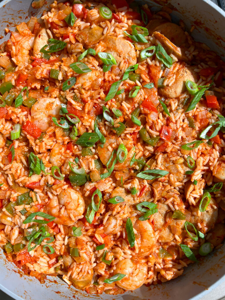 15-Minute Healthy Jambalaya Recipe in large pan topped with green onion