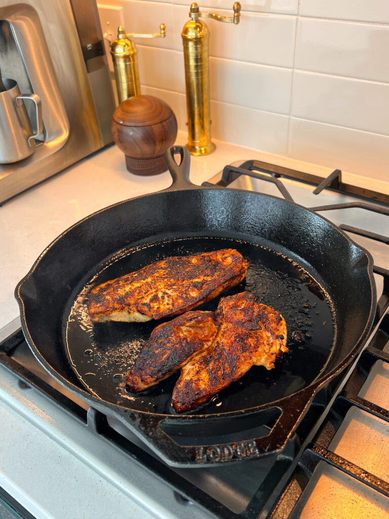 chipotle chicken pan-searing in cast iron pan